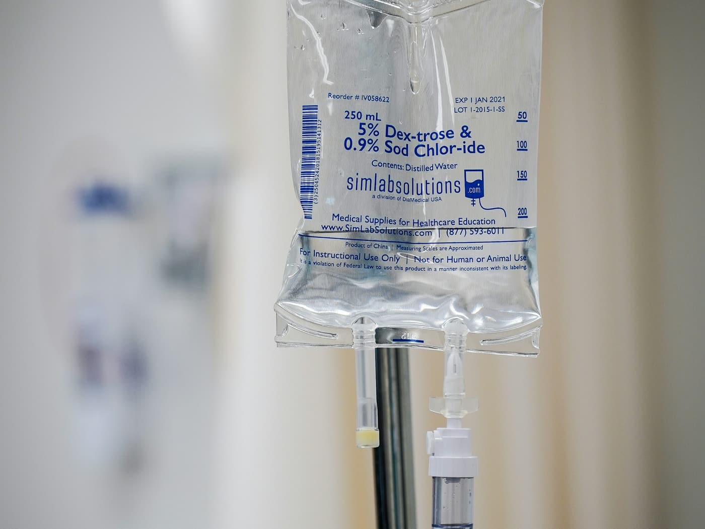 A 250 mL dextrose and sodium chloride infusion bag hanging from a pole